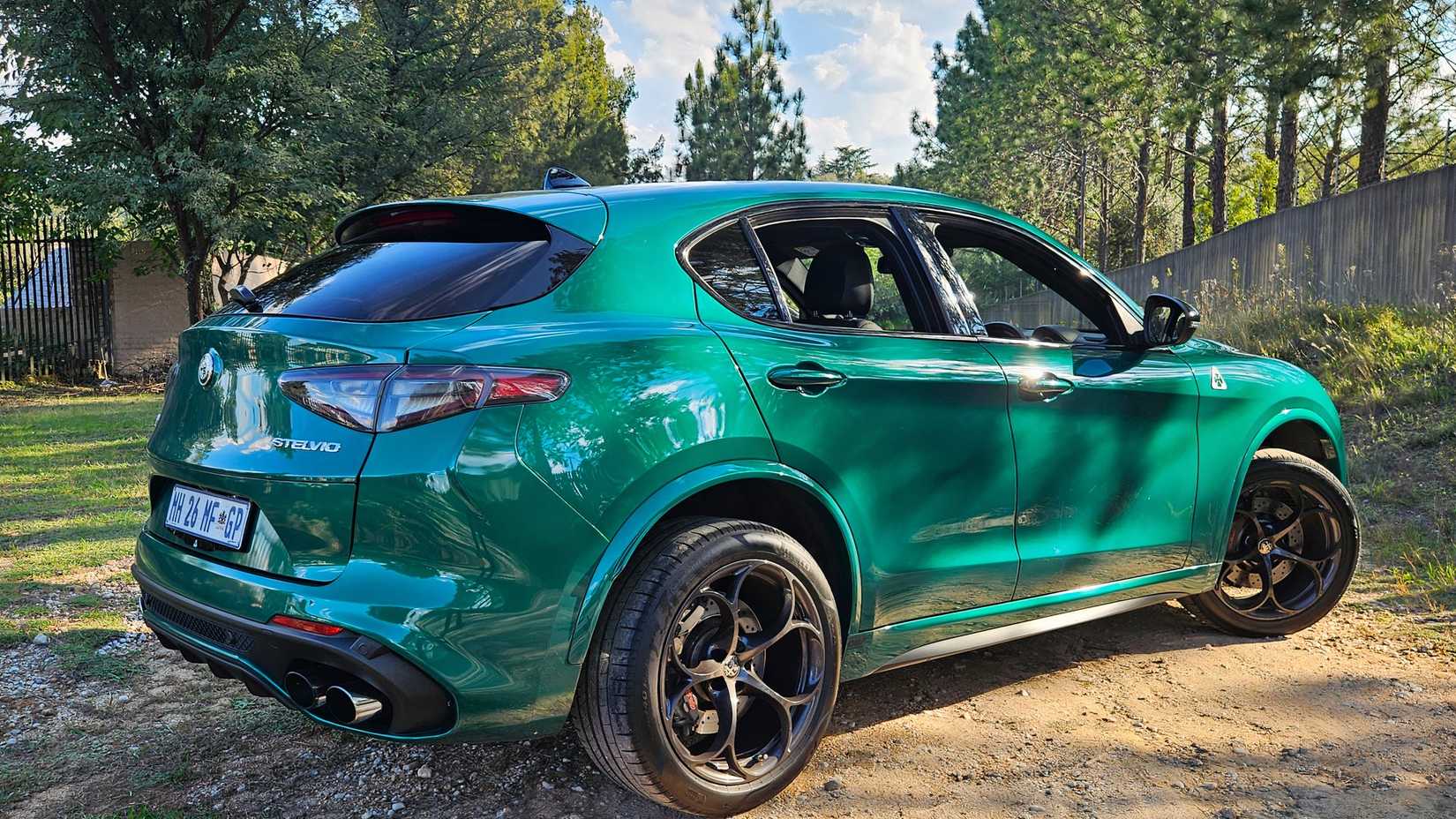 2026 Alfa Romeo Stelvio Quadrifoglio in Verde Montreal parked at a forest