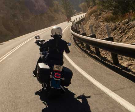 Rider on a 2026 Harley-Davidson Heritage Classic entering a curve