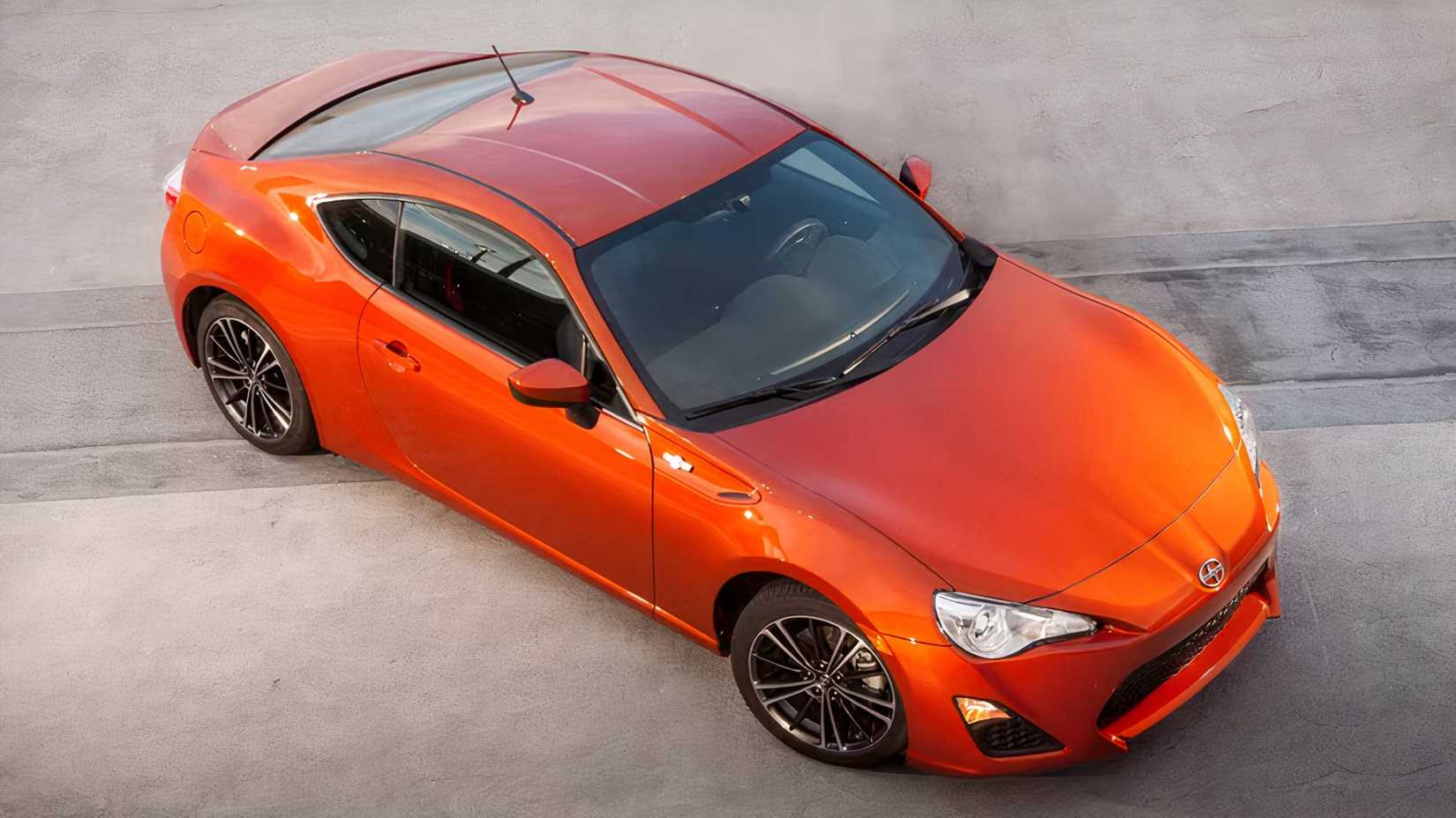 High-angle 3/4 shot of 2016 Scion FR-S parked on tarmac