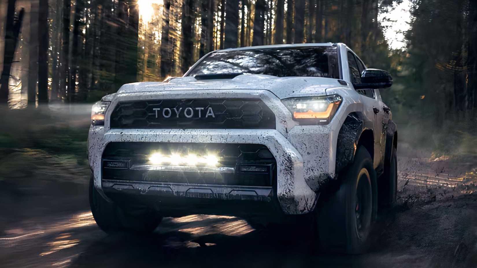Front 3/4 action shot of 2026 Toyota 4Runner driving off-road