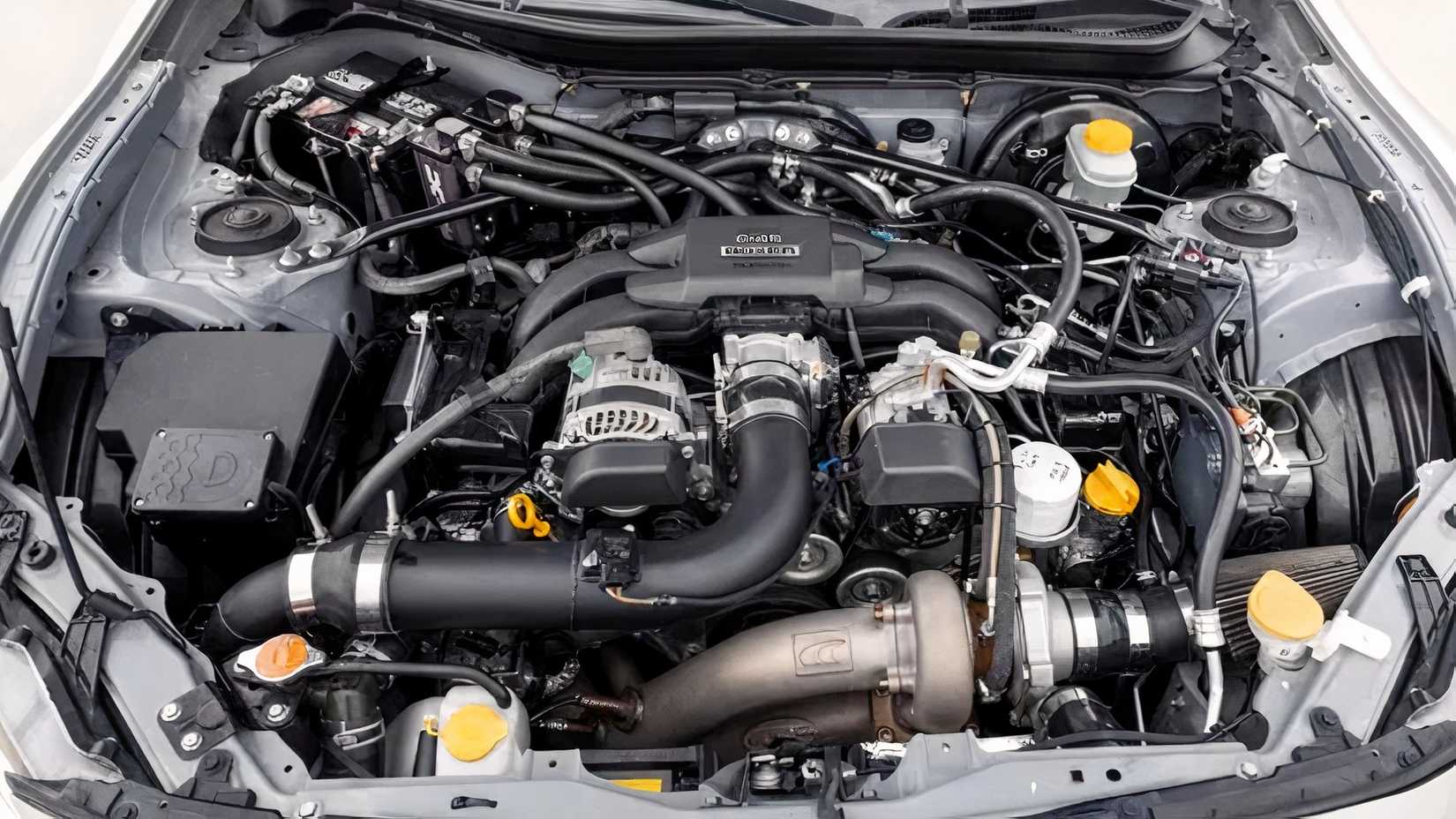 Close-up shot of 2016 Scion FR-S engine bay showing FA20 flat-four