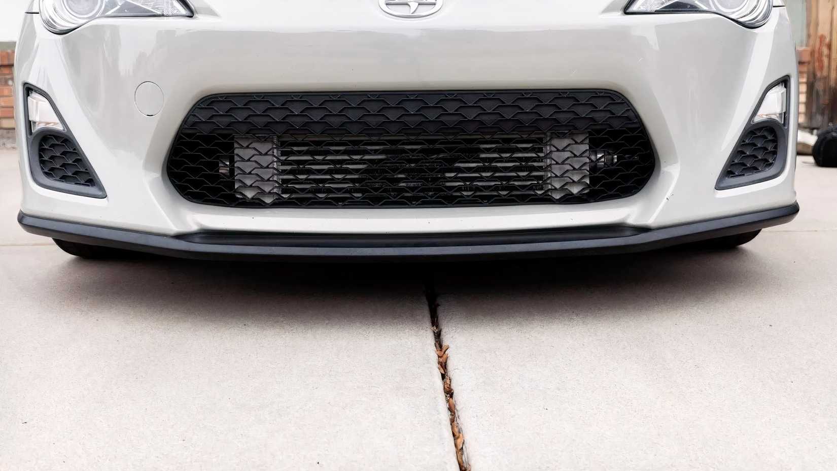 Close-up shot of 2016 Scion FR-S grille and front lip