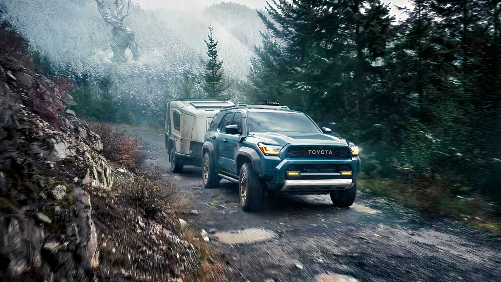 Front 3/4 action shot of 2026 Toyota 4Runner towing off-road