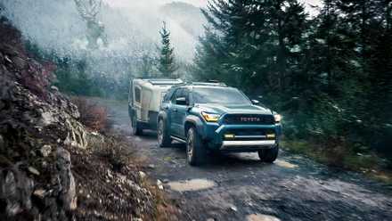 Front 3/4 action shot of 2026 Toyota 4Runner towing off-road