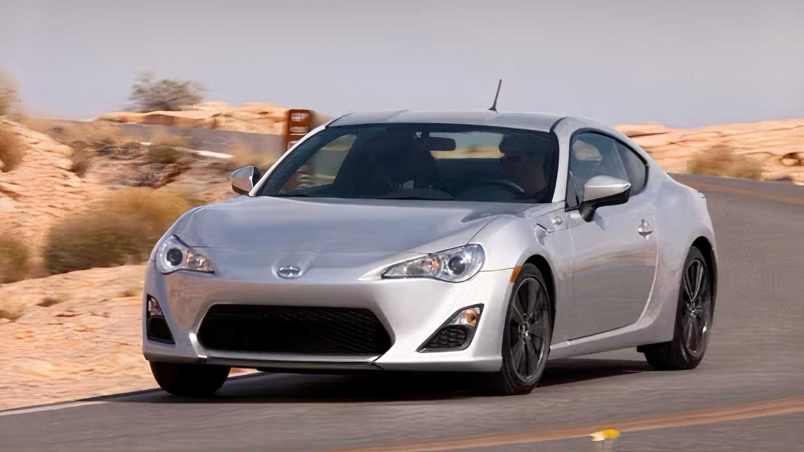 Front 3/4 action shot of 2016 Scion FR-S driving on road