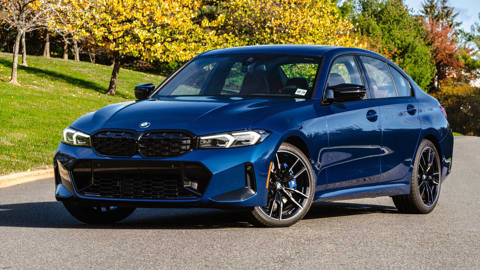 2026 BMW M340i front 3/4 parked on the road