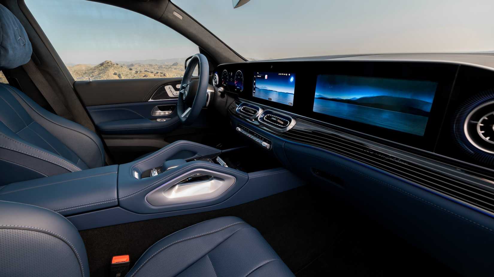 2027 Mercedes-Benz GLE Class interior dashboard layout with three displays side cinemtic shot