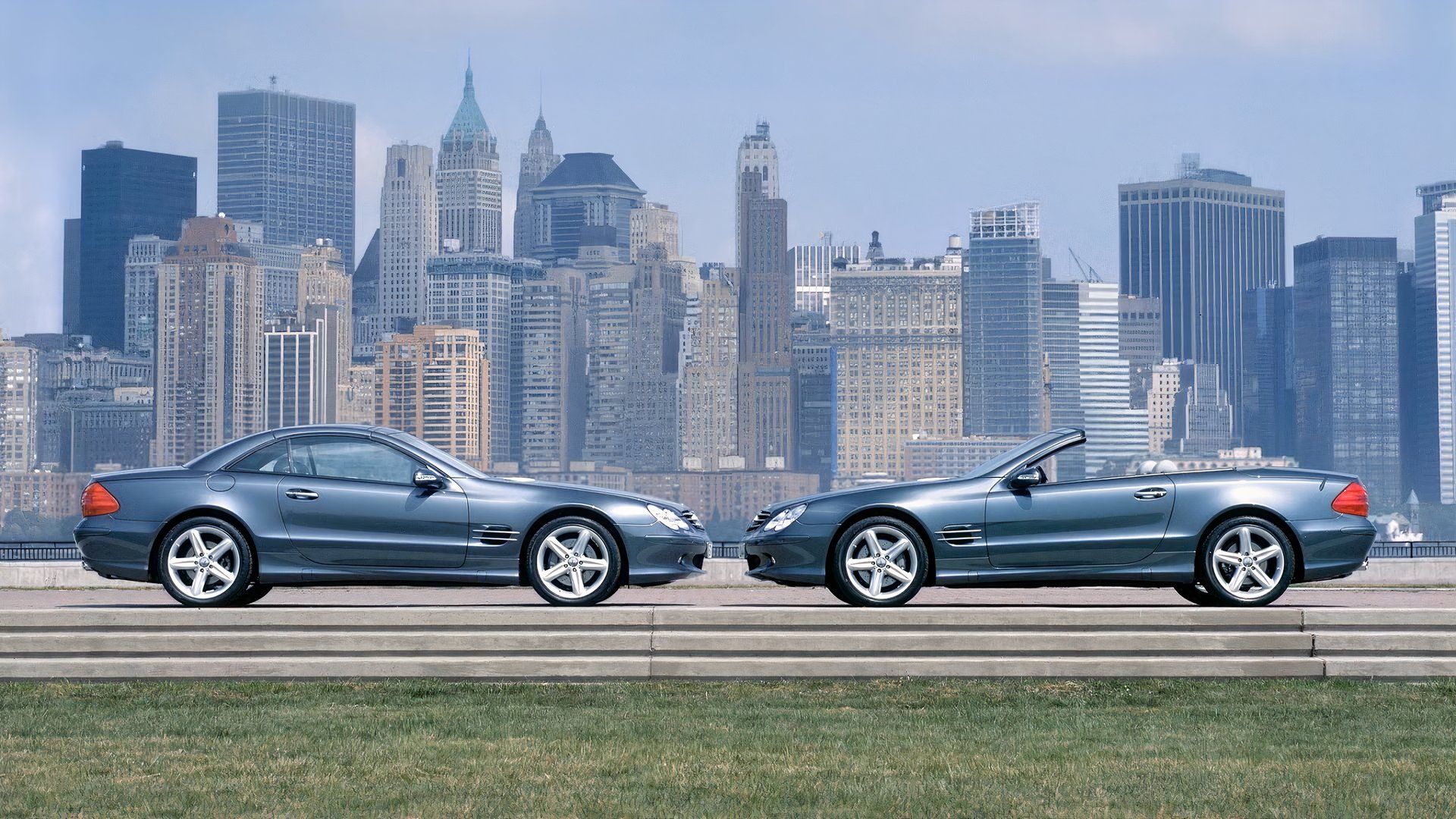 A set of R230 Mercedes-Benz SL roadsters parked in front of the New York City skyline