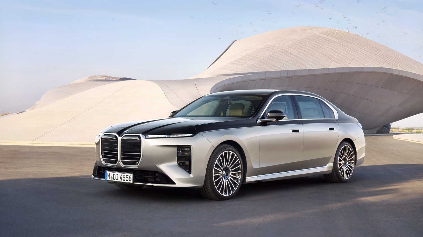 Front 3/4 shot of a 2027 BMW 7 Series parked on the road