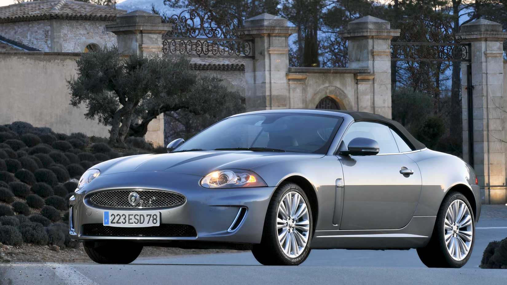 Front 3/4 shot of a 2011 Jaguar XK parked in front of house