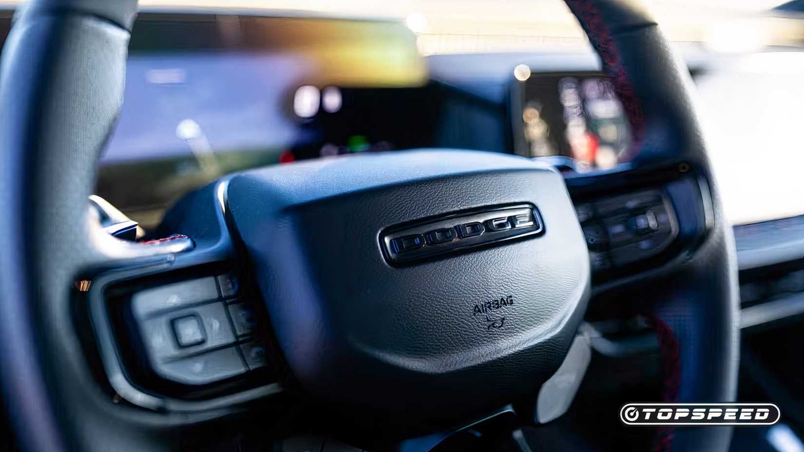 Interior shot of a 2024 Dodge Charger Daytona Scat Pack's steering wheel