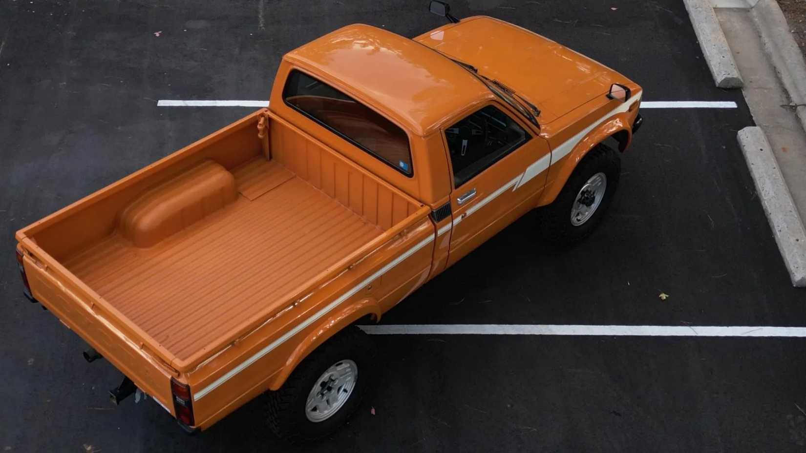 Ariel shot of a 1980 Toyota Hilux 4x4 4-Speed in parking lot