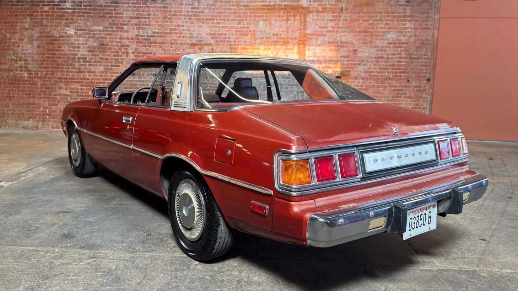Rear 3/4 shot of a 1978 Plymouth Sapporo parked in garage
