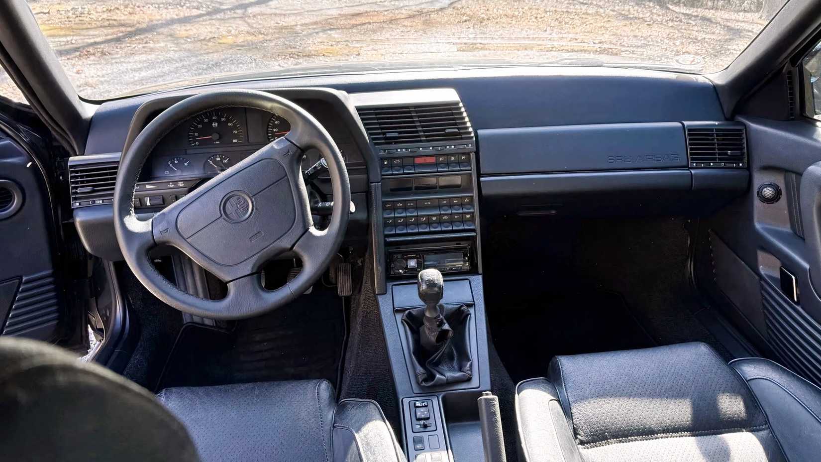 Interior shot of a 1995 Alfa Romeo 164 showing front cabin