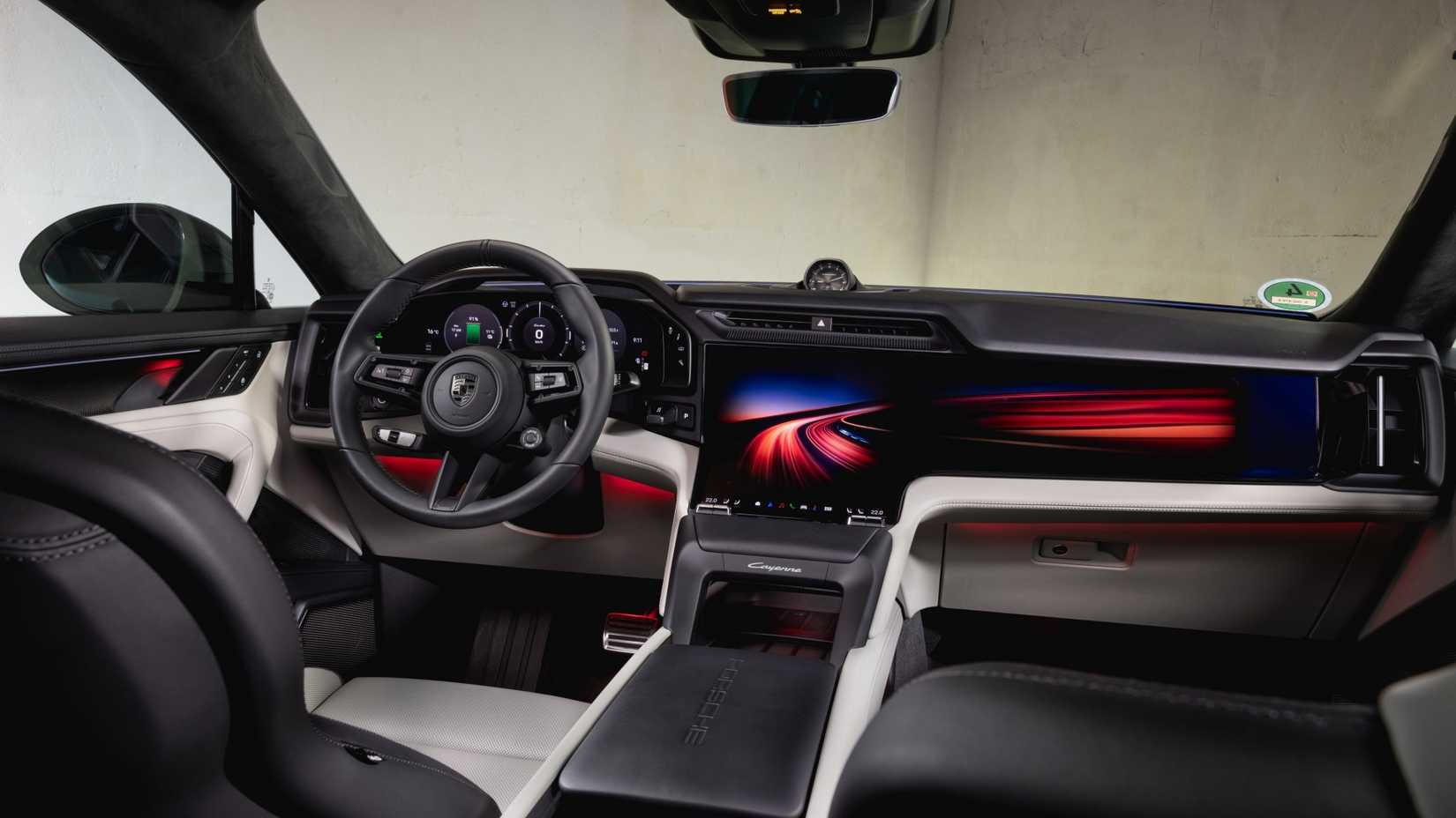 Foto do interior de um Porsche Cayenne Coupe Electric 2026 mostrando a cabine dianteira