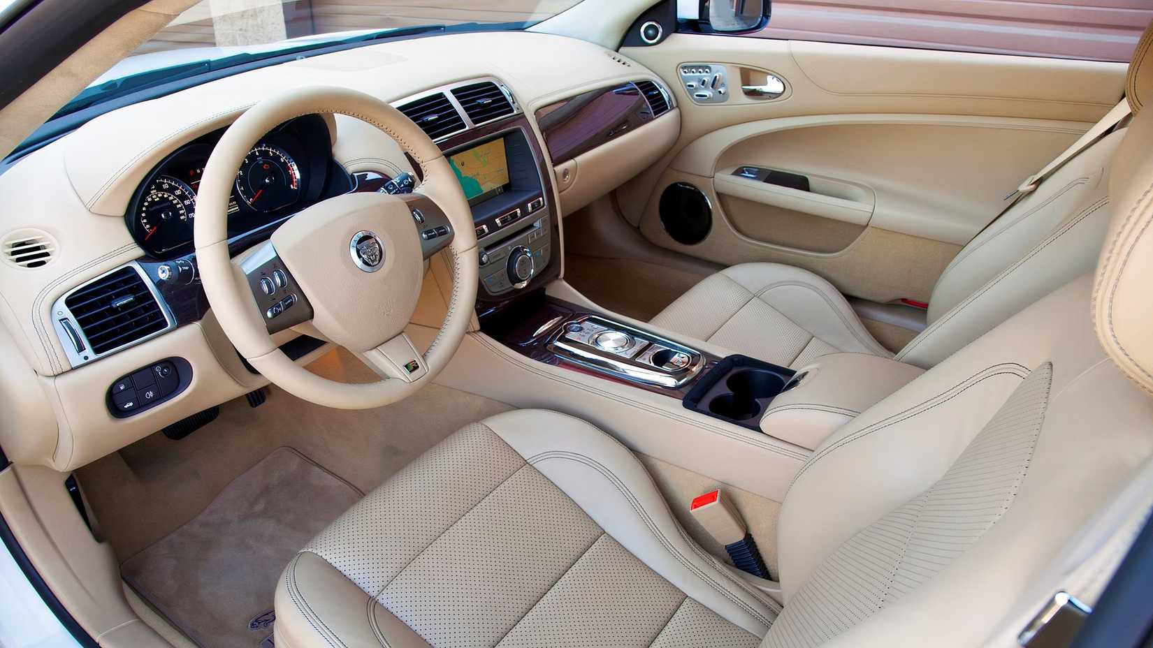 Inteior shot of a 2011 Jaguar XK showing the driver's side cabin