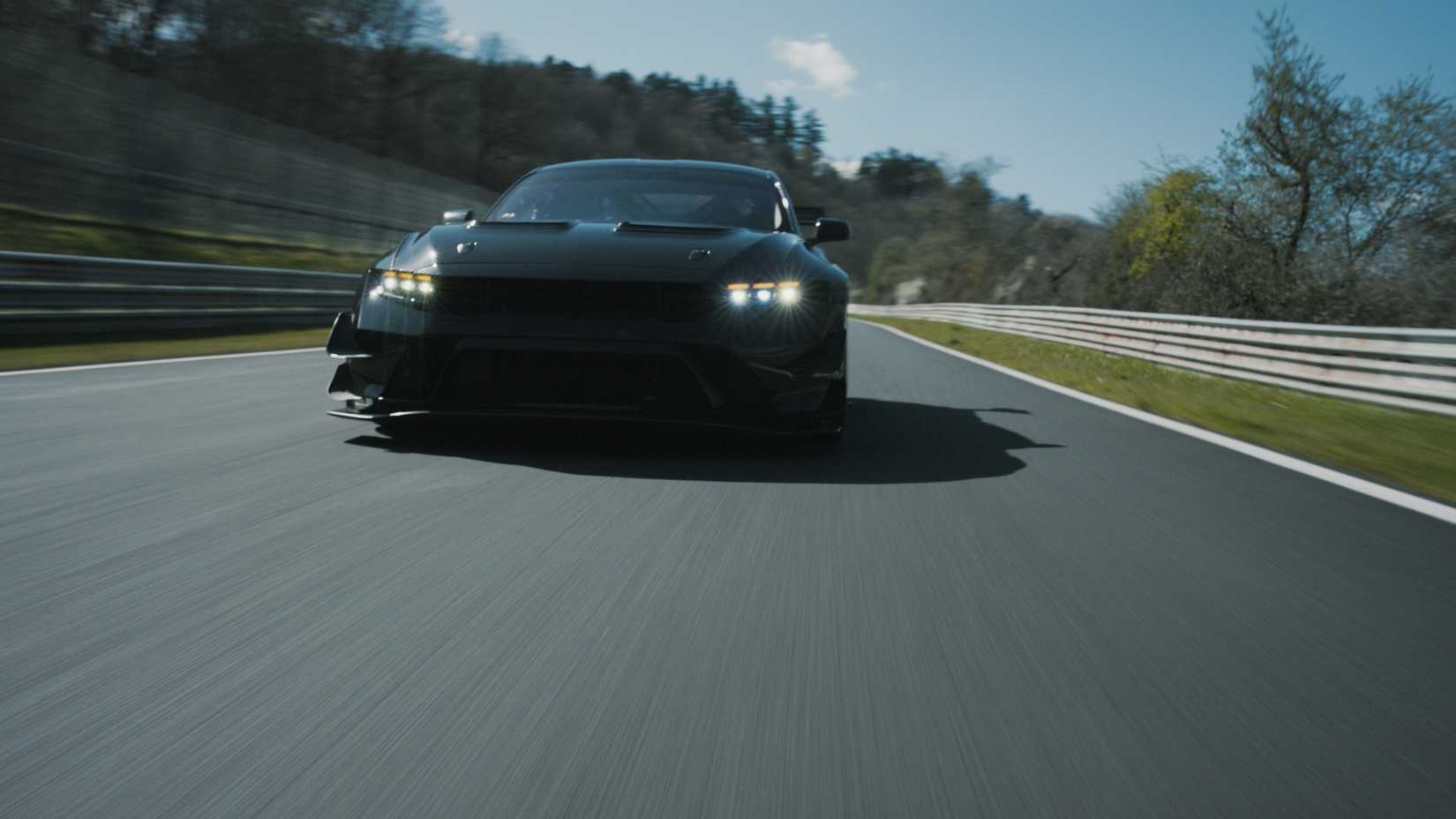Front shot of a Ford Mustang GTD Competition driving on track