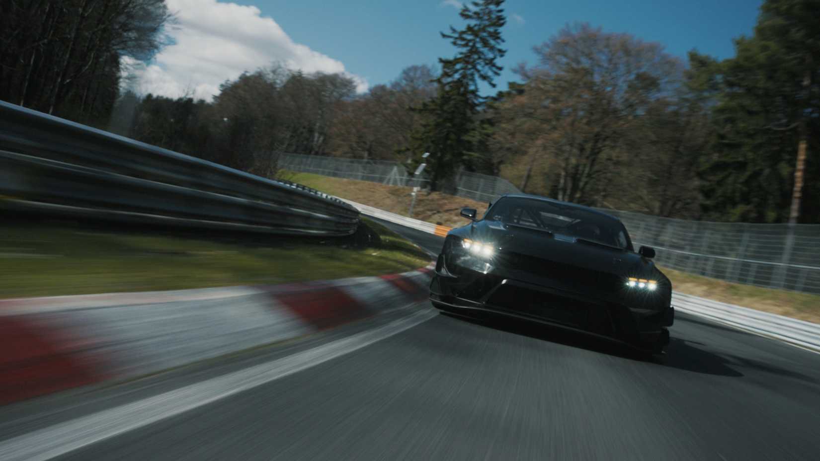 Front shot of a Ford Mustang GTD Competition driving on track