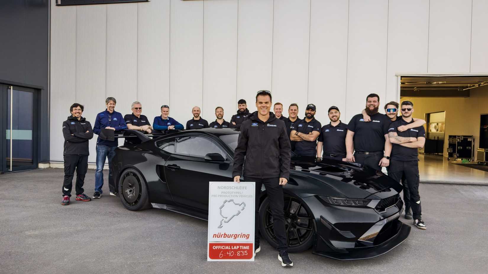 Ford Racing and Multimatic team standing in front of the record-breaking Mustang GTD Competition