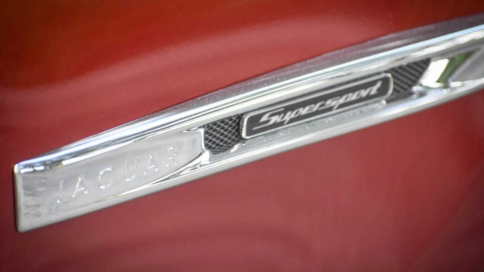 Close-up shot of a 2011 Jaguar XJL Supersports badge