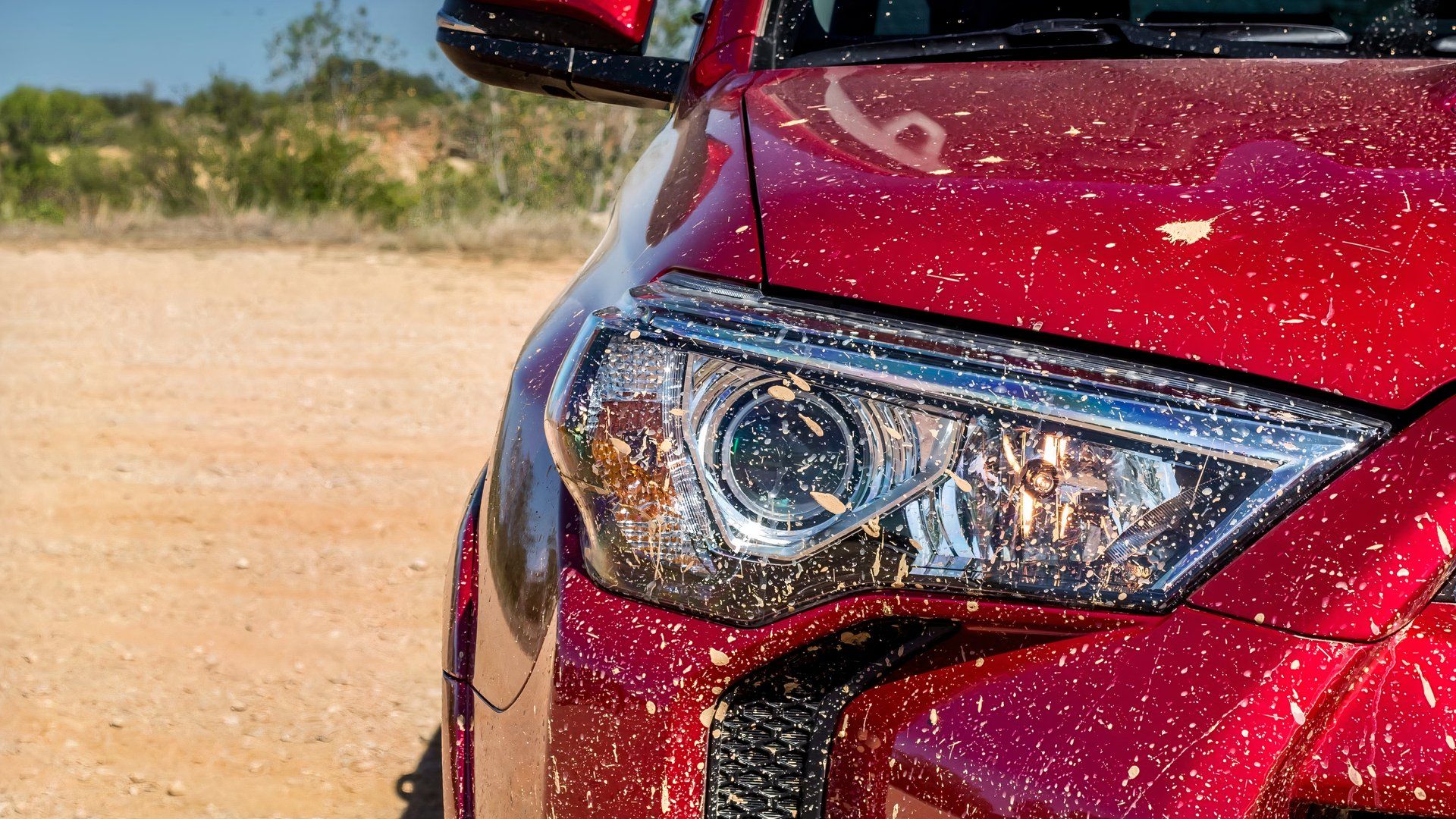 Front close-up of a red 2017 Toyota 4Runner's headlight