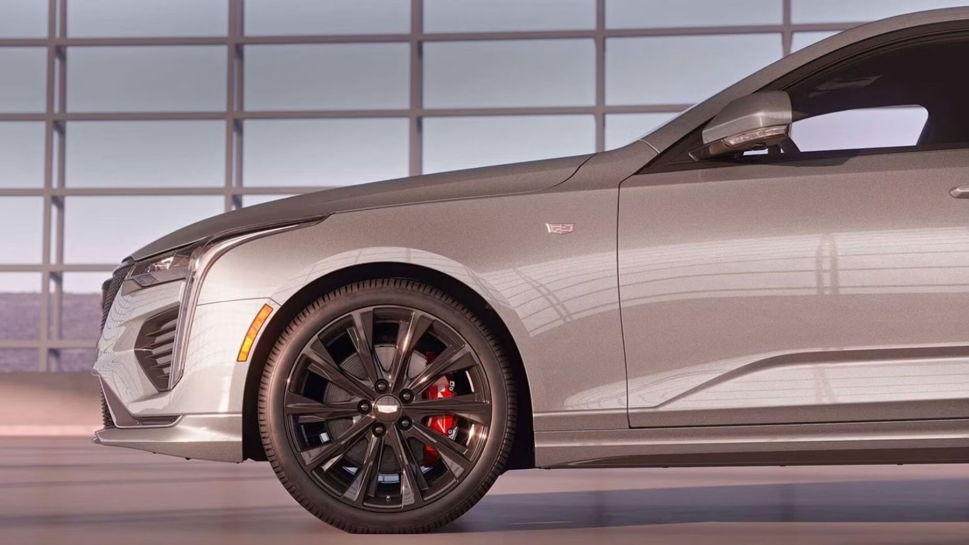 Front-end shot of a 2026 Cadillac CT4 parked indoors