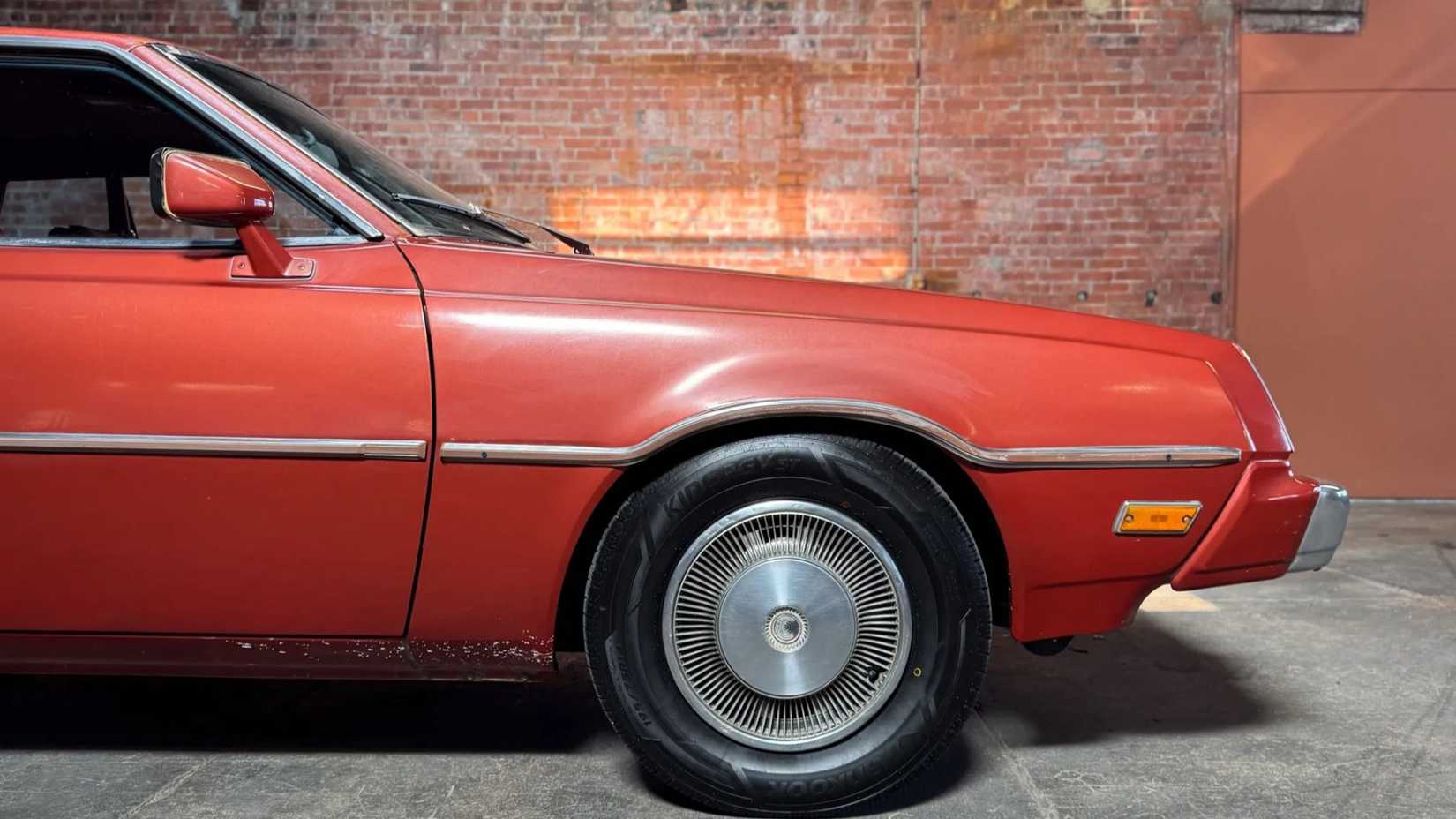 Front-end shot of a 1978 Plymouth Sapporo parked in garage