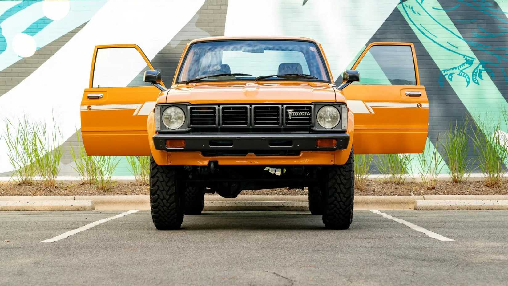 Front shot of a 1980 Toyota Hilux 4x4 4-Speed with doors open