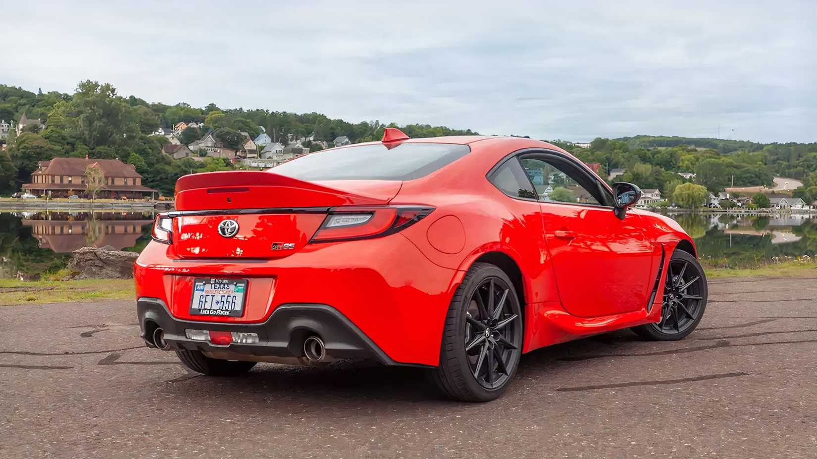 Rear 3/4 shot of a red 2026 Toyota GR86 parked in lot