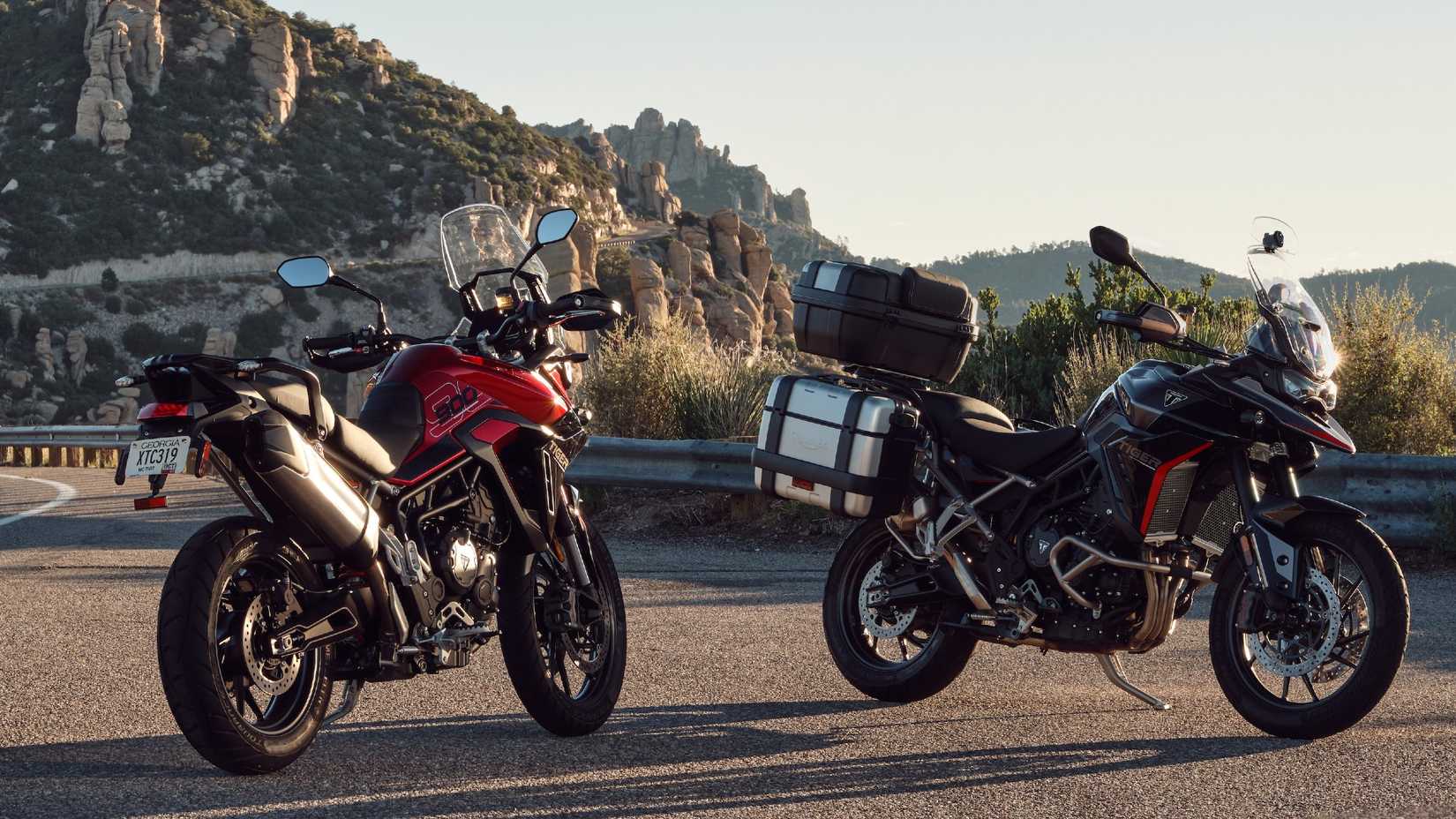 Two 2025 Triumph Tiger 900 GT Pro models parked on the side of the road