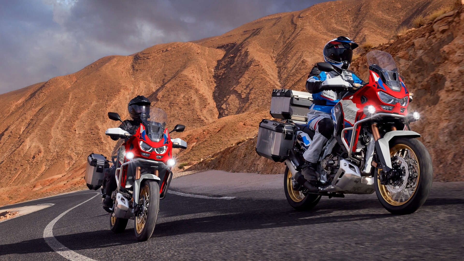 Two 2026 Honda Africa Twin ADventure Sports riding in the canyons
