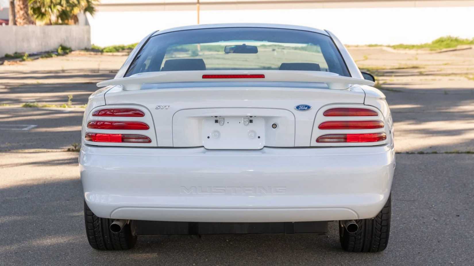 Rear shot of a 1995 Ford Mustang SVT Cobra R parked on the street