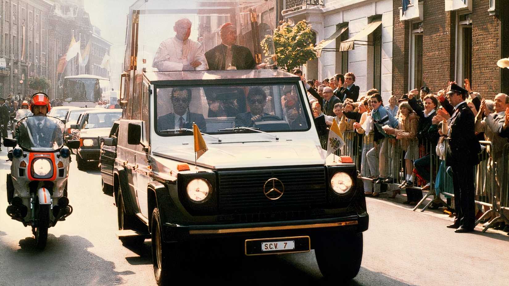 1980 Mercedes-Benz 230 G Popemobile front shot driving through crowded city street