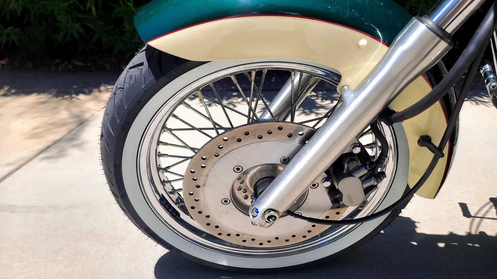 1998 Honda Shadow ACE 1100 close up of front brake and spoke wheel