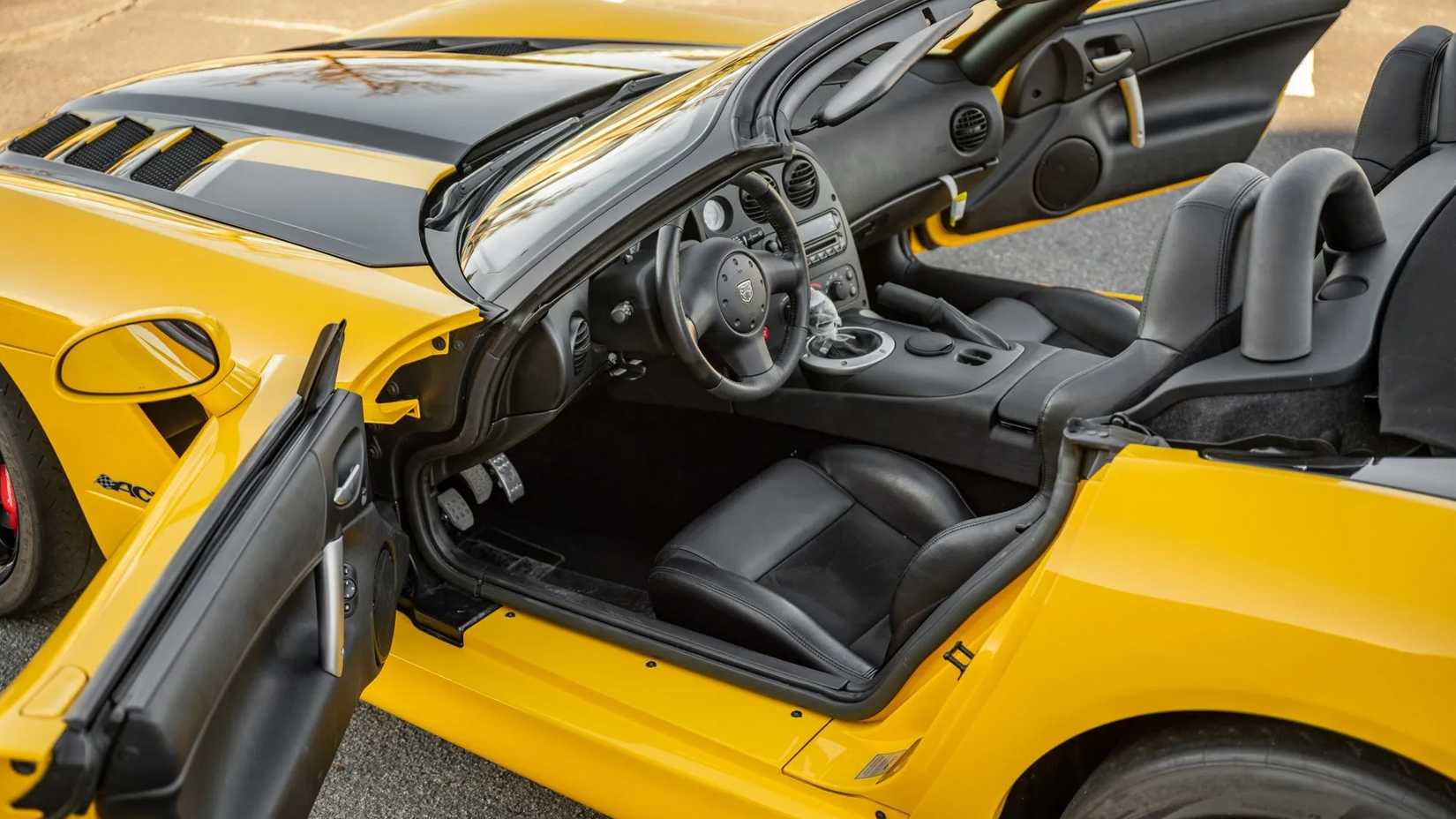 Yellow 2010 Dodge Viper SRT-10 Roadster ACR side shot showing interior