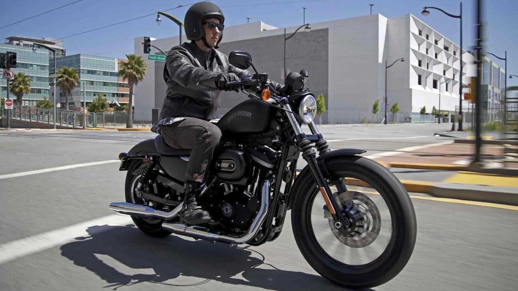 2010 Harley-Davidson Sportster Iron 883 rolling on the streets front third quarter view
