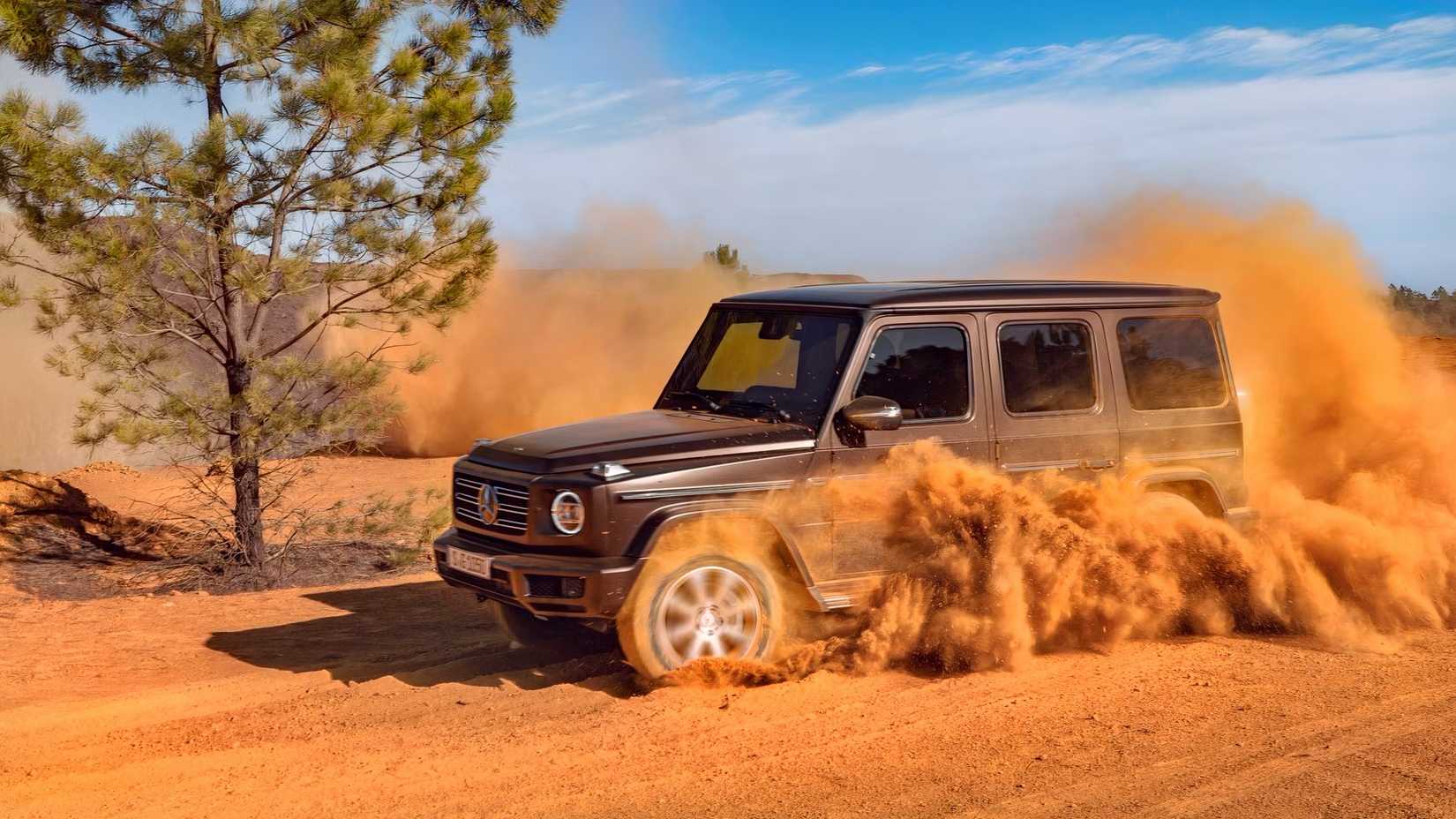 Front 3/4 shot of a 2023 Mercedes-Benz G-Class Kicking Up Dirt