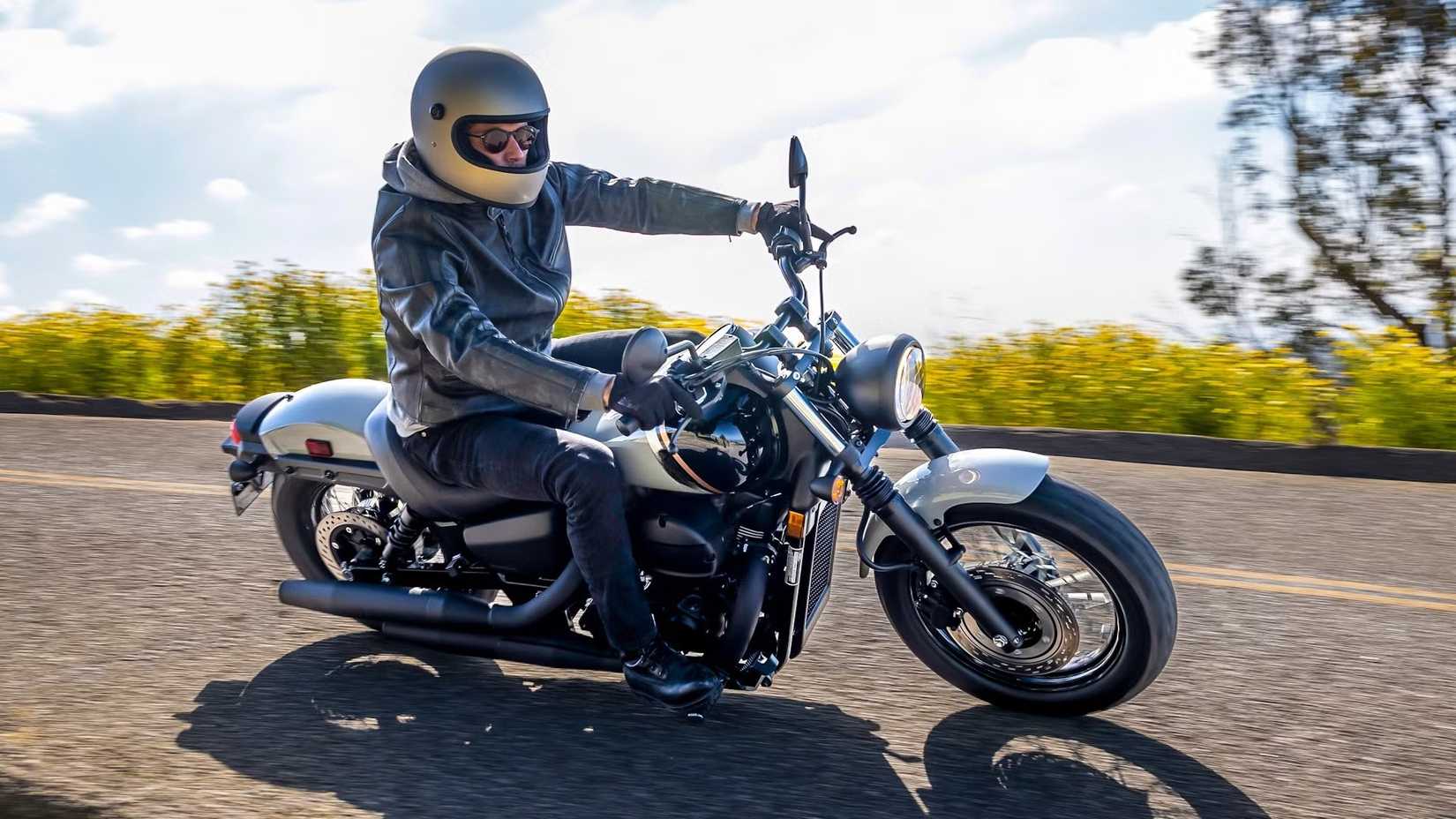 Honda Shadow Phantom leaning into a curve, front third quarter shot