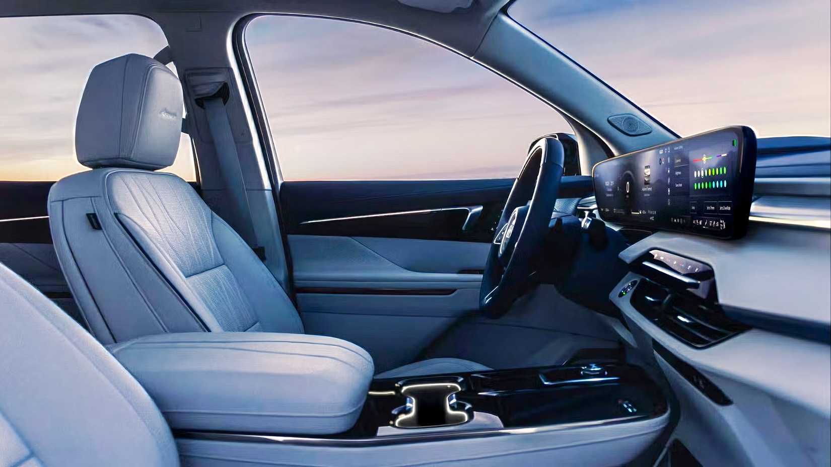 Foto do interior de um Buick Enclave 2026 mostrando bancos dianteiros e painel