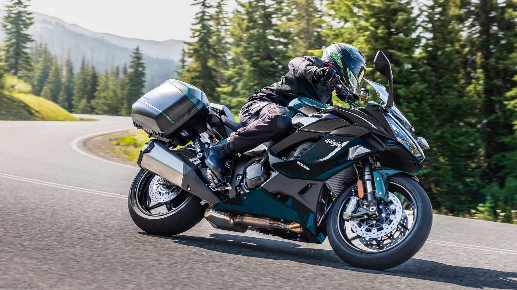 Black 2026 Kawasaki Ninja 1100SX SE ABS taking a turn in the hills