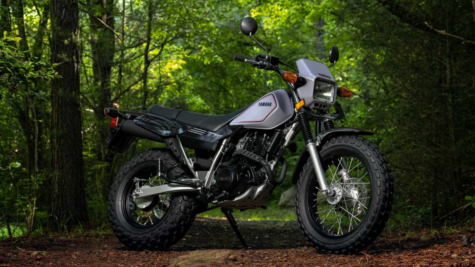 2026 Yamaha TW200 parked on an off-road trail front third quarter view