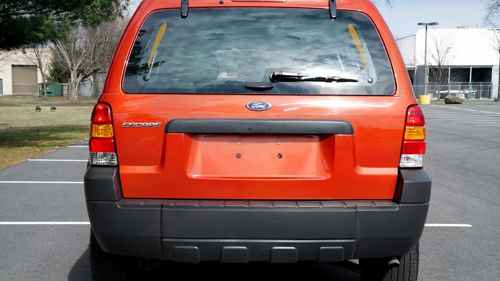 2007 Red Ford Escape Rear Shot parked in lot