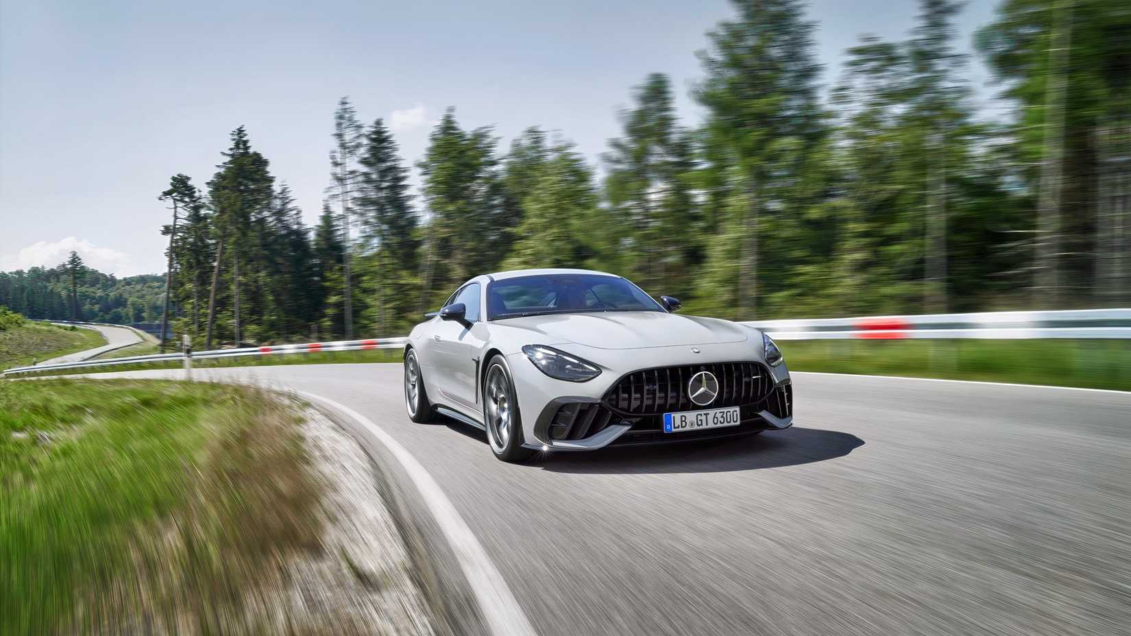 Front 3/4 action shot of 2026 Mercedes-AMG GT63 driving on track