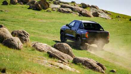 2026 Nissan Navara rear 3/4 action driving off-road