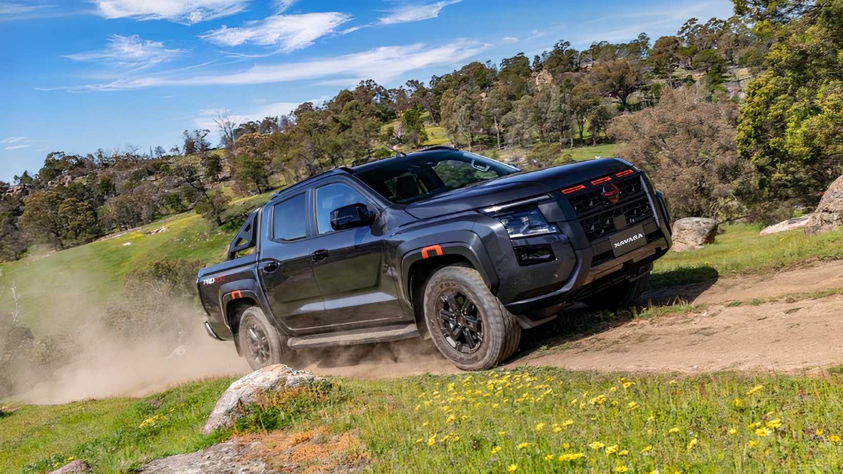 2026 Nissan Navara front 3/4 driving off-road