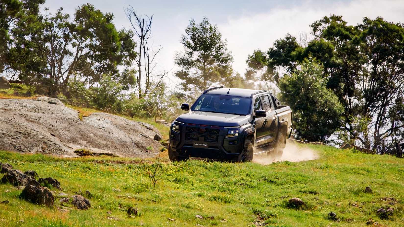 2026 Nissan Navara front 3/4 driving off-road