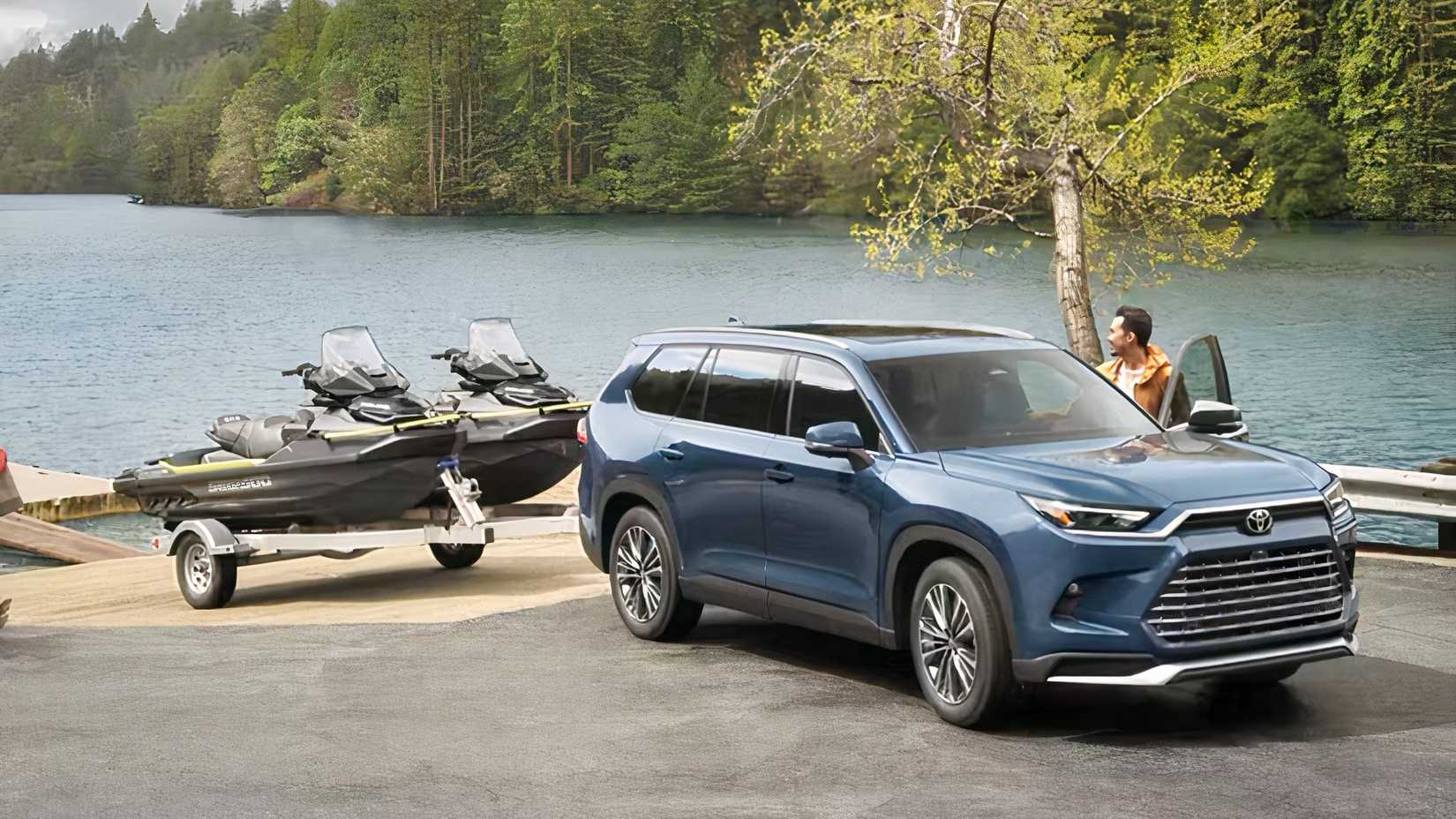 2026 Toyota Grand Highlander Hybrid parked by lake