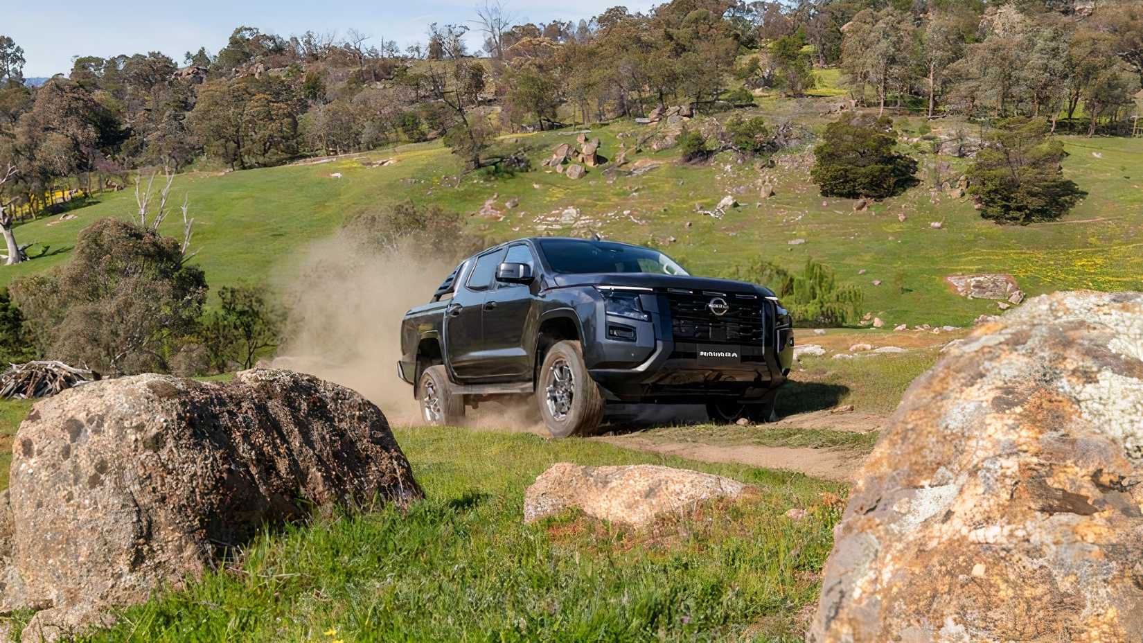 2026 Nissan Navara front 3/4 driving off-road