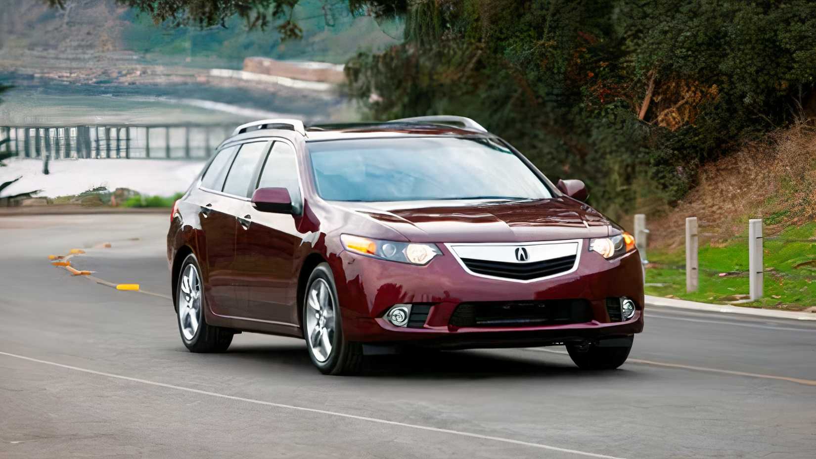 Front 3/4 action shot of 2014 Acura TSX Sport Wagon driving on road