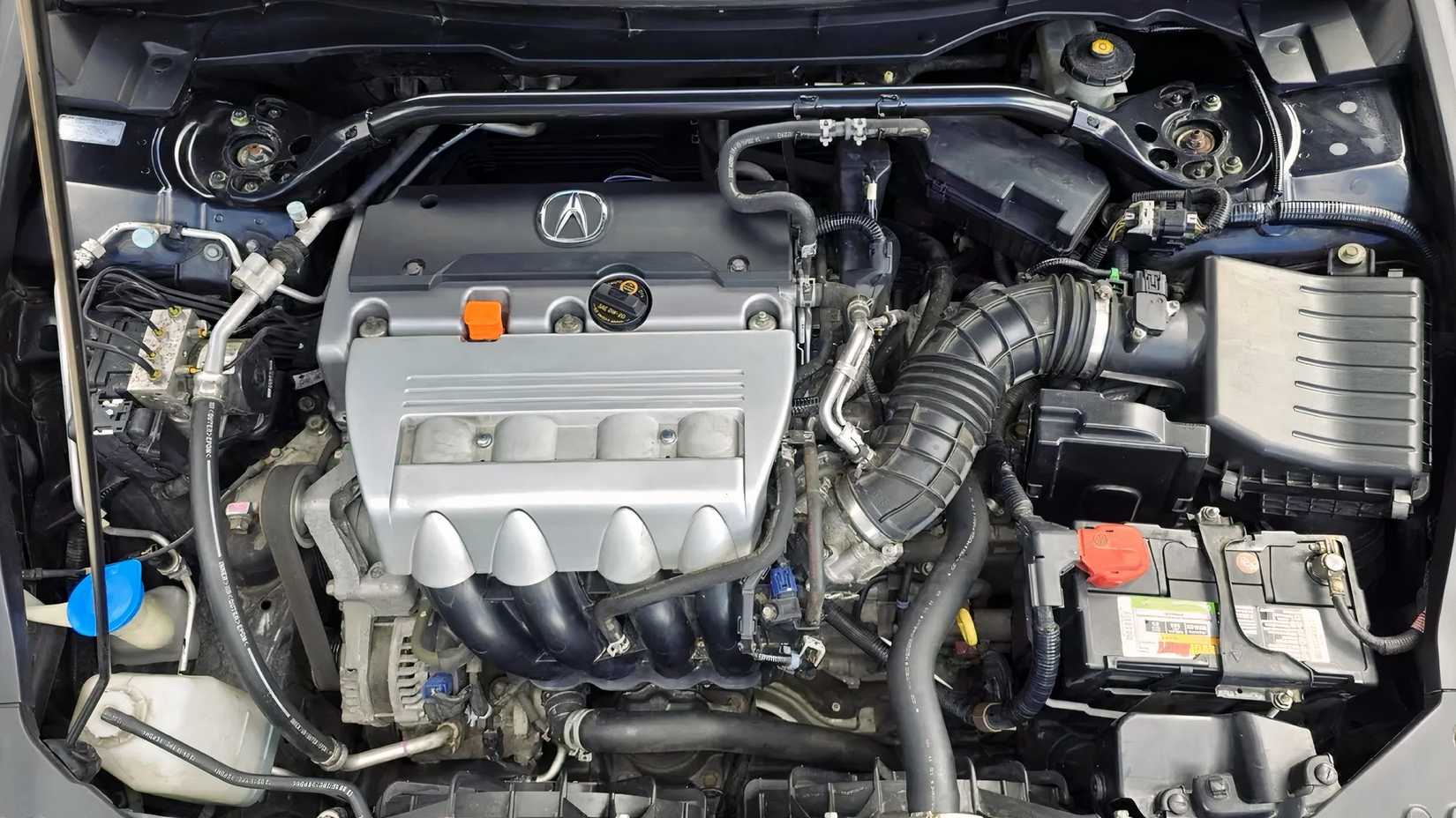 Close-up shot of 2011 Acura TSX Sport Wagon engine bay showing K24 engine